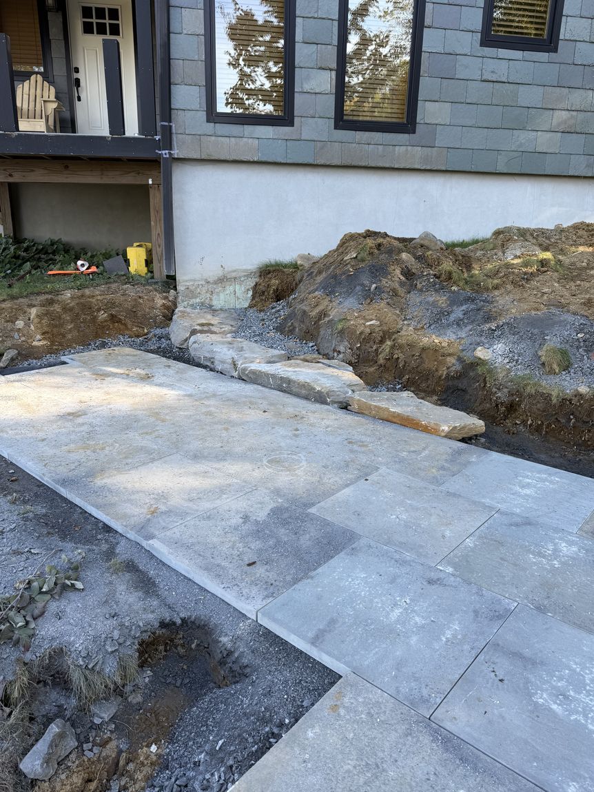 Flagstone walkway under a covered entry